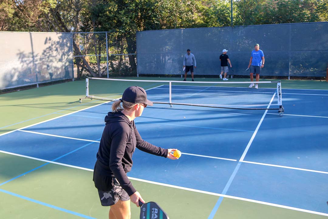 October 14, 2019 | San Luis Obispo Country Club | Tennis member, Heidi Gill, gets ready to serve the first ball of the game. Games are played to 11 points. 
