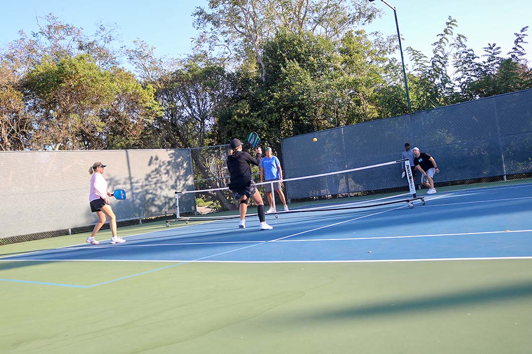 October 14, 2019 | San Luis Obispo Country Club | Heidi charges the net to reach the ball as the final point of the game is played out. 
